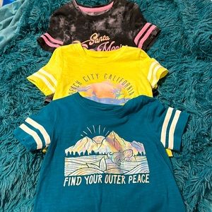 Bundle of three girls graphic tees. Size 8.